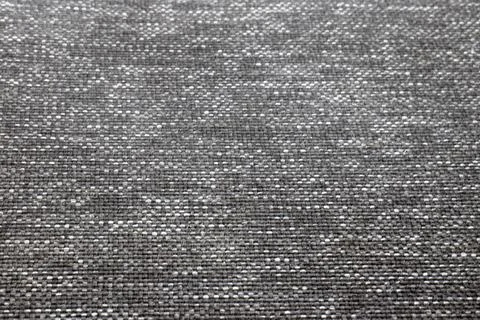 Close-up of textured gray fabric with subtle patterns, ideal for backgrounds and Stock-Fotos