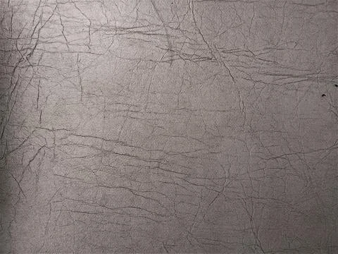 Close-up of Textured Gray Leather Surface with Fine Cracks and Wrinkles Fotos Stock