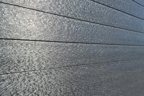 Close-up of textured gray stone pavement with grout lines Stock Photos