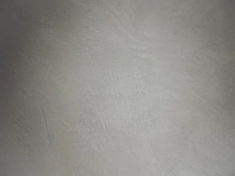 Close up of a textured grey plaster wall with artisic wall coating paints Stock Photos