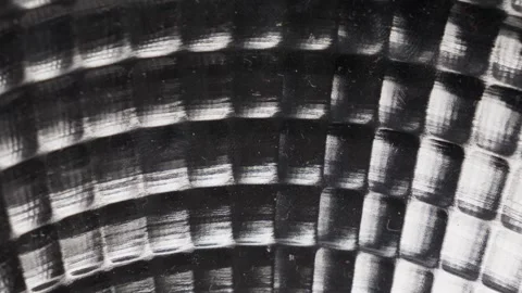 Close-up of a textured metal surface with a hypnotic circular pattern, Stock Footage 270130299
