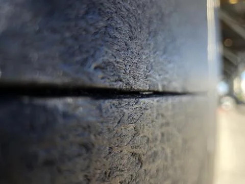 Close up of textured metal surface with sharp crack line Stock Photos