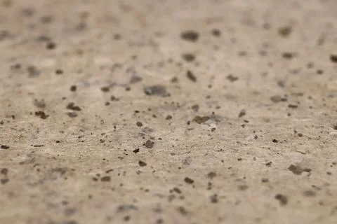Close-up of a textured paper texture surface with small stones. Stock Photos