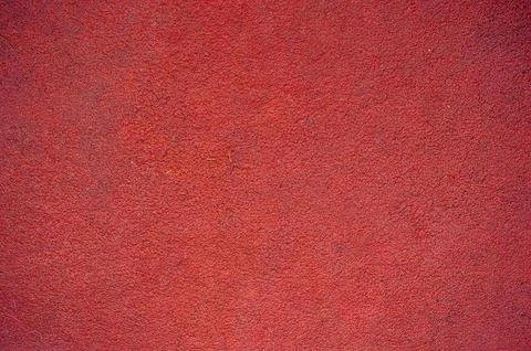 Close up of textured red track surface with granular finish, ideal for spor.. Fotos Stock