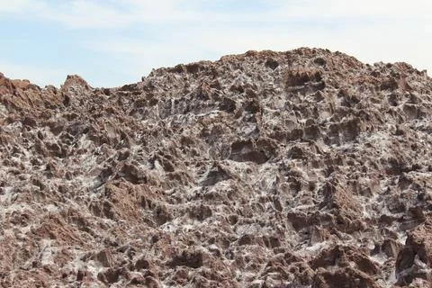 Close up of textured, rocky surface in a desert landscape, stock photo. Stock Photos