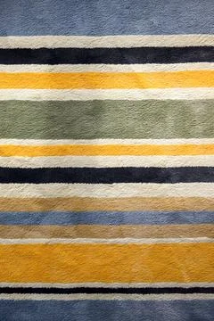Close-up of textured rug with multicolor horizontal stripes. Detailed fabri.. Stock Photos