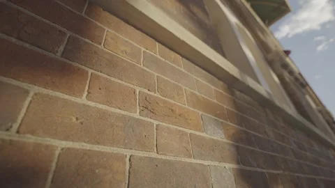 Close Up of Textured Sandstone Brick Wall in Sunlight Stock Footage 345011058
