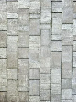 Close-up of textured stone pavement with rectangular tiles, showcasing a blend Stock Photos