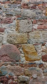 Close-up of a Textured Stone Wall Showcasing Various Stone Colors and Pattern Stock Photos