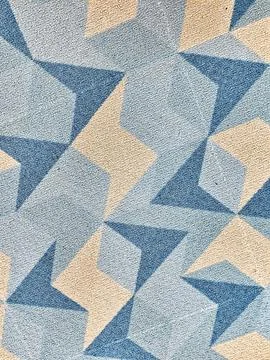 Close-up of a textured surface featuring an abstract geometric pattern with b Stock Photos