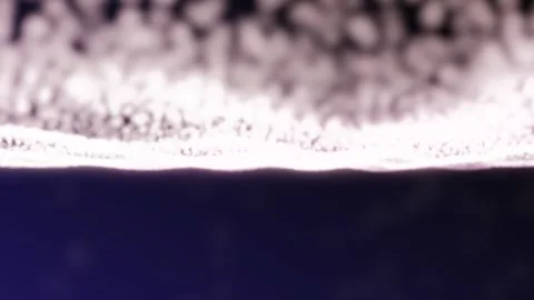 A close-up of a textured surface with overlapping blurred images of a possibly Stock Footage 340534994