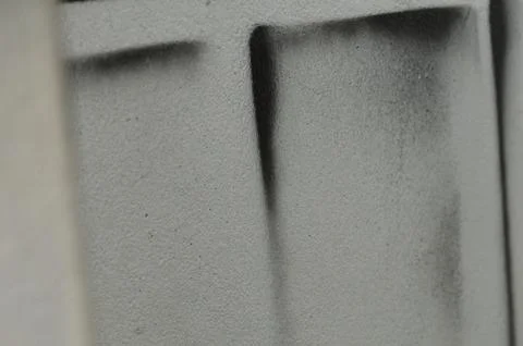 Close-Up of Textured Wall with Abstract Black Spray Paint Pattern Stock Photos