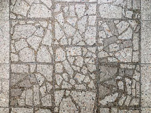 Close-up of textured wall with diagonal grid of rectangular tiles, showing .. Stock Photos