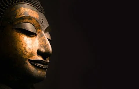 Close up Thai Ancient Solid Head of Buddha, antique bronze Buddha face of Wat Stock Photos