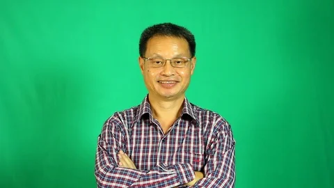 Close up Thai man with green background, in studio Chiangmai Thailand Stock Footage 116716442