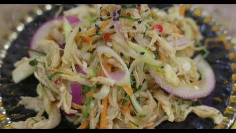 Close-up of Thai-Style Shredded Chicken Salad with Vegetables Stock Footage 328522471