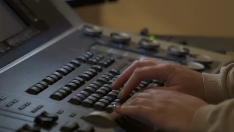 Close-up of theater worker hands pushing buttons on equipment. moving light Vídeo Stock 119888563