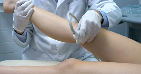 Close-up of therapist Doctor doing shock wave therapy on Knee for a Sport Fit Stock Footage