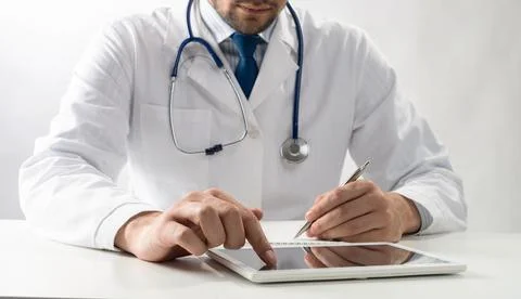 Close up of therapist hands using tablet computer Stock Photos