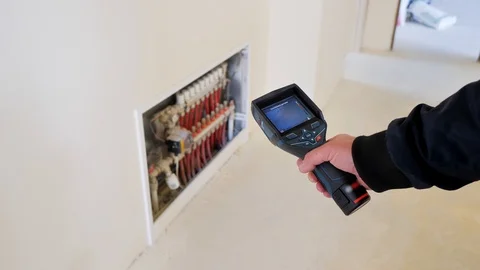 Close-up. Thermal imaging. The engineer checks the pipe with a thermal imager Stock Footage 129070199