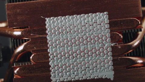 Close-up of thermal paste on the CPU cooling system. 스톡 동영상 143366362