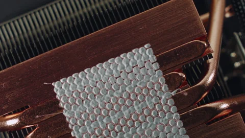 Close-up of thermal paste on the CPU cooling system. 스톡 동영상 143366601