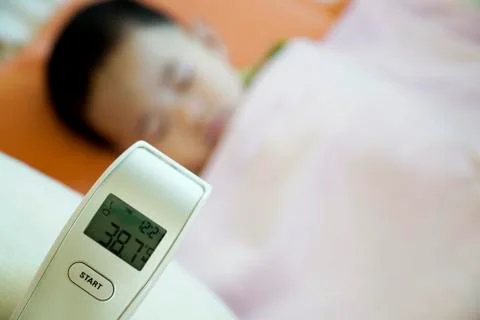 Close-up of thermometer after measuring the temperature of child with a fever. Stock Photos