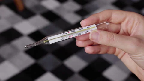 Close up of the thermometer with big temperature at home at coronavirus outbreak Stock Footage 139373465