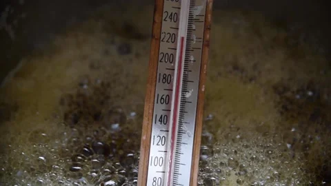 Close-up of a thermometer in boiling maple syrup for cooking Stock Footage 167173112