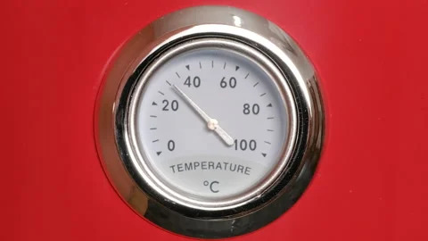 Close-up of a thermometer gauge displaying a range from 0C to 100C. Stock Footage 292533901