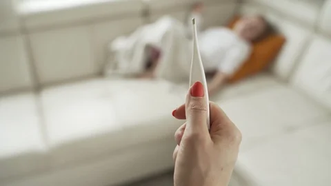 Close-up thermometer. Mother measuring temperature of her ill kid. Sick child Stock Footage 97444341