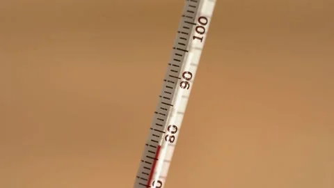 Close up of a thermometer rising to over 100 degrees Stock Footage 165124973