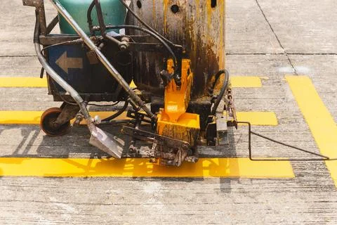 Close up of thermoplastic spray marking machine making lines for painting t.. Stock Photos