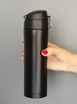 Close up thermos mock up gray background. High quality photo Stock Photos
