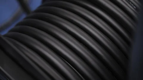 Close-up of thick black stage cable coiled on reel Stock Footage 308624885