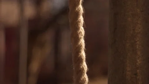Close-up of Thick Braided Rope Swaying in Wind Near Steel Pole 库存影片 331504895