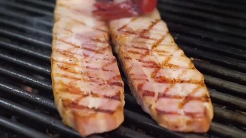 Close-up of Thick-Cut Pork Belly Strips Sizzling on Barbecue Grill Video stock 332814767