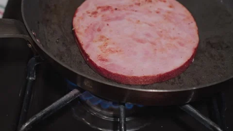 Close-up of Thick Ham Steak Searing on a Blue Gas Flame Stock Footage 323332699