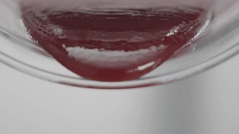 Close-Up of Thick Jam Pouring Out of Glass Jar with Rich Color and Texture Stock Footage 221292866