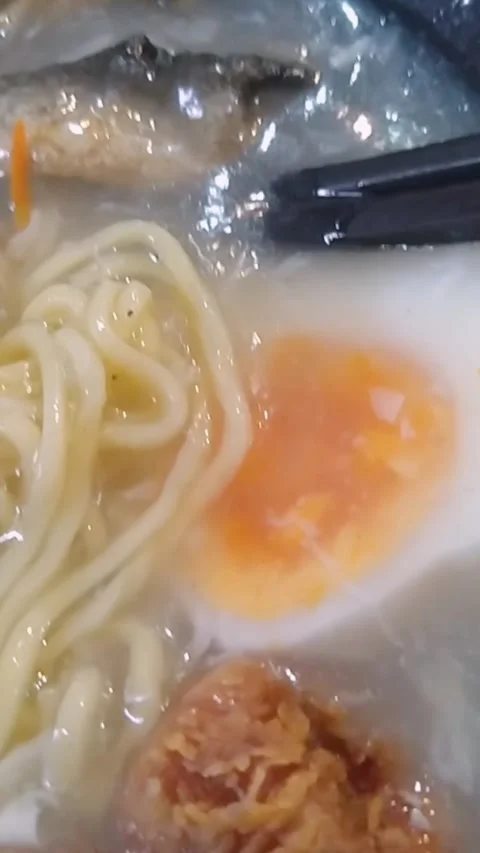 Close Up of Thick Rich Broth Japanese Ramen Bowl with Chicken and Egg Stock Footage 345021005