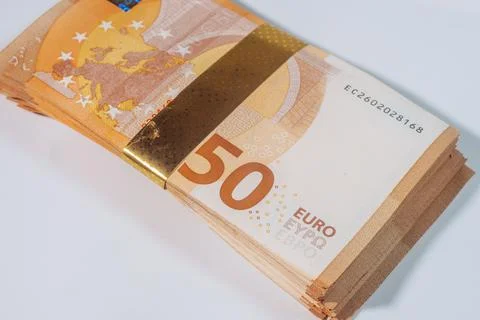 Close-up of a thick stack of 50 euro banknotes held together with. Фото