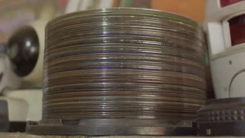 Close-up of thick stack of old DVD discs, showing layered edges, vintage te.. Stock Footage 318731353