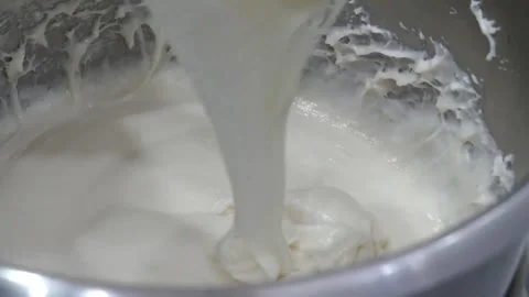 Close-Up of Thick White Sourdough Starter Slime or Glue Being Lifted from Metal Stock Footage 345291856