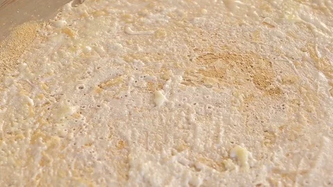 Close-up of a thin dough cake that is fried on a tandoor. Stock Footage 118236314