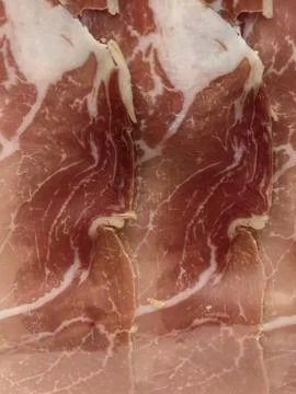 Close-up of thin dry-cured prosciutto ham slices Stock Photos