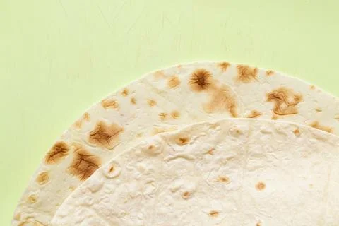 Close-up of thin pita bread texture on green cutting board related to bread,  Stock Photos