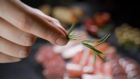 Close up of thin slices of prosciutto with dry raw sausages and swiss cheese on Stock Footage 125504569