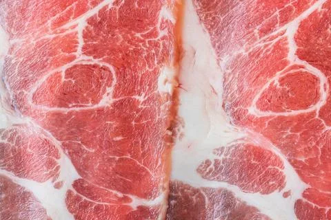 Close up of thinly sliced raw beef with marbling Stock Photos