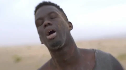 Close-up of thirsty and worn-out black guy 05 Video stock 67559062