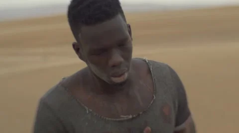 Close-up of thirsty and worn-out black guy 07 Video stock 67559159